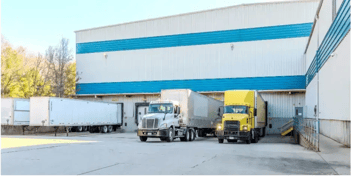 exterior photo of warehouse building truck bay