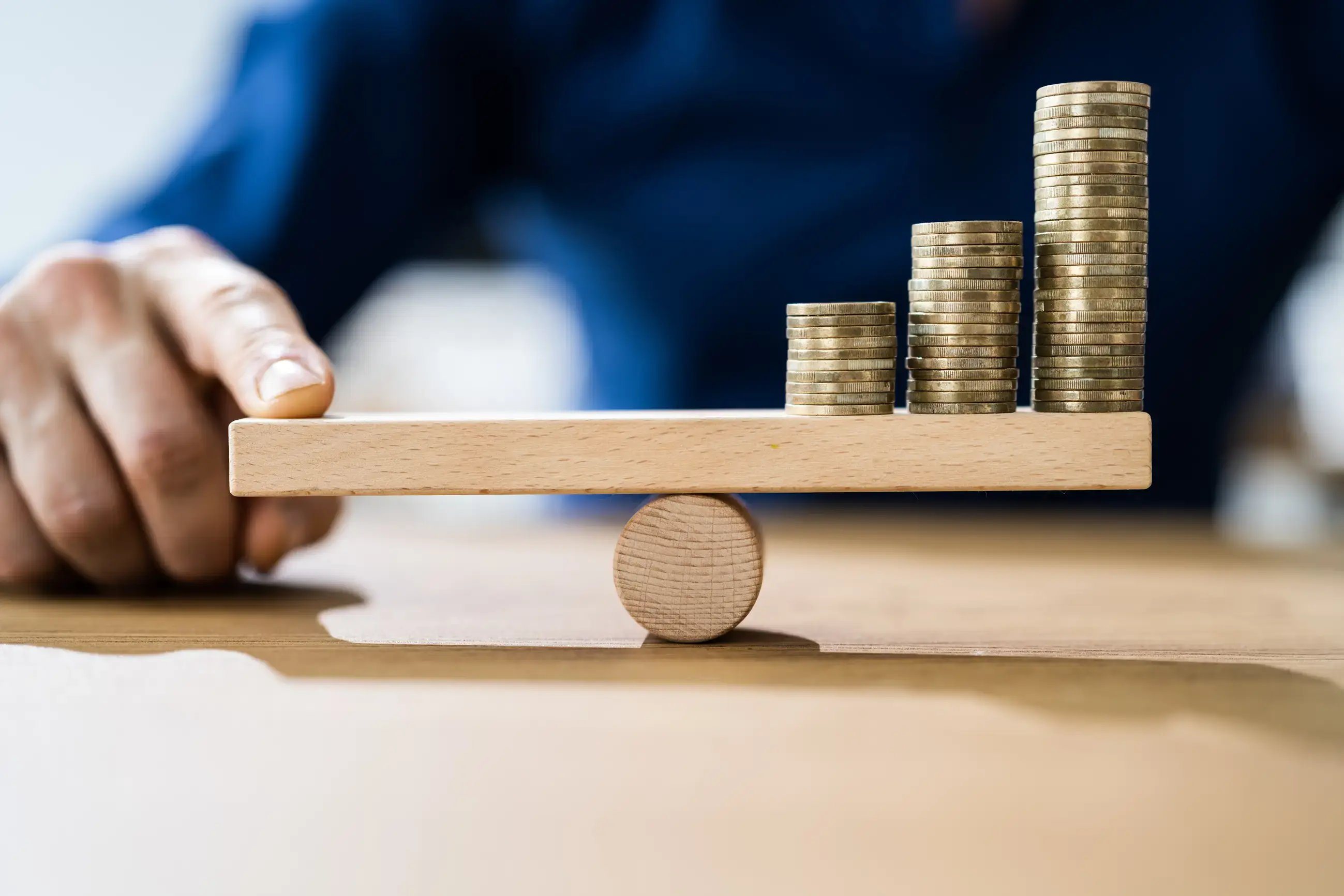 Balancing leveraged buyout strategies with stacked coins symbolizing financing and value growth. 