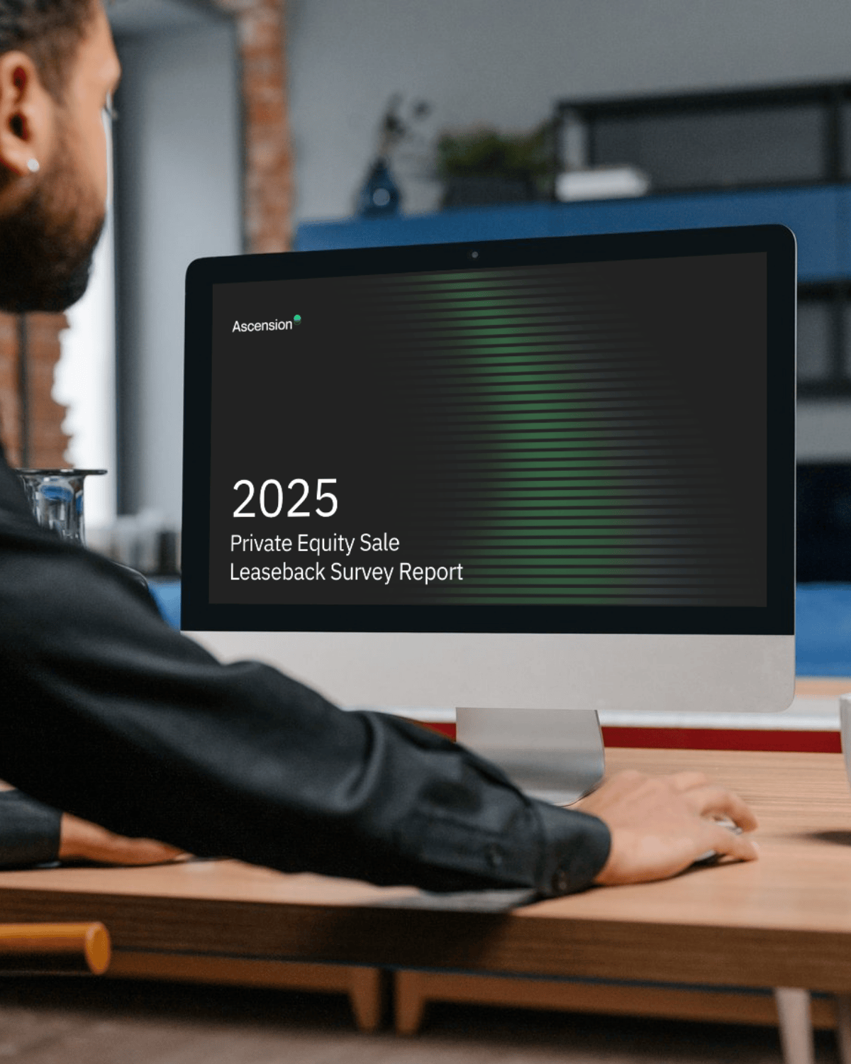 man looking at the 2025 private equity sale leaseback survey report on his computer 